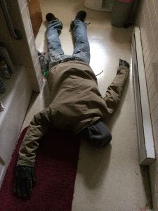april-fools-day-pranks-leave a dressed up dummy lying face down in the bathroom floor